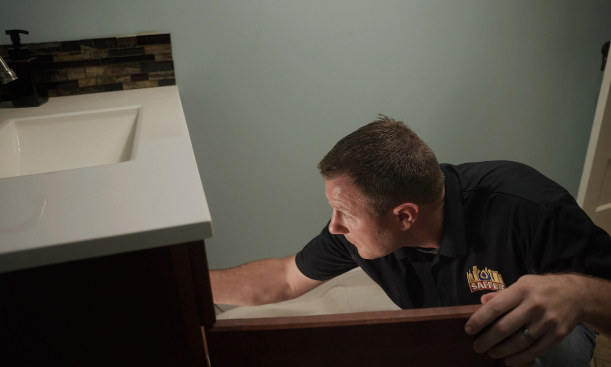 handyman working with sink