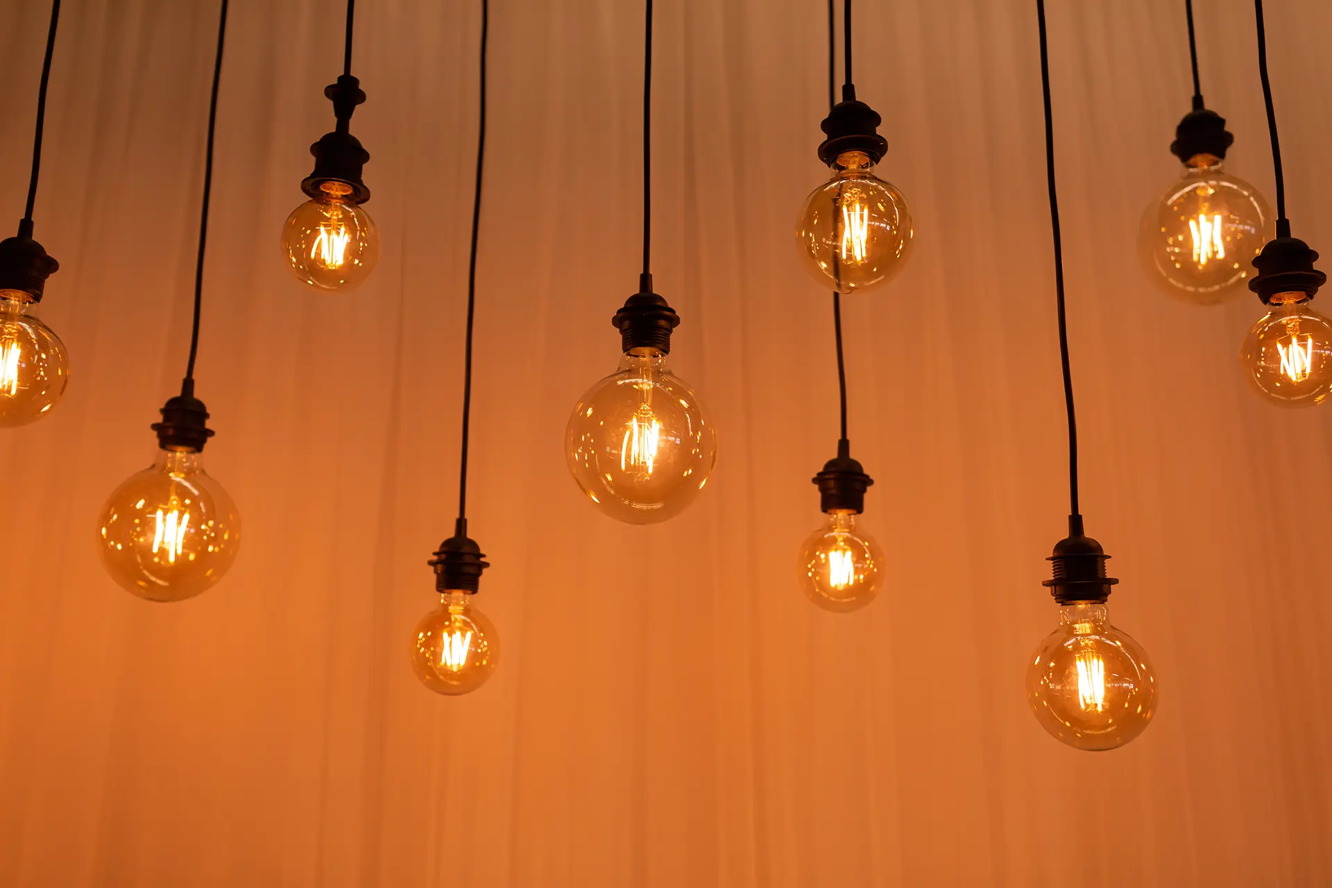 several Edison light bulbs hanging