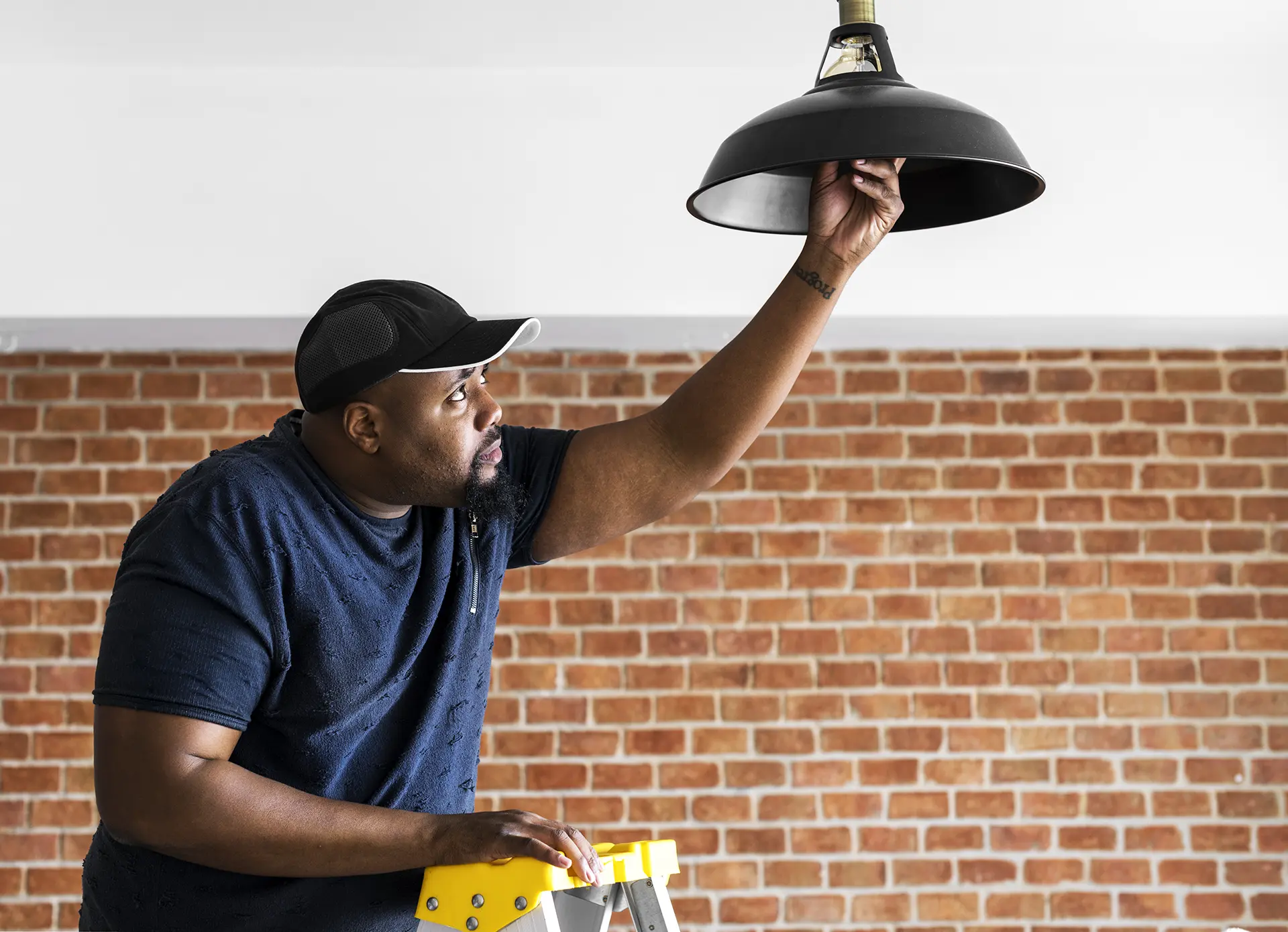 man changing lightbulb