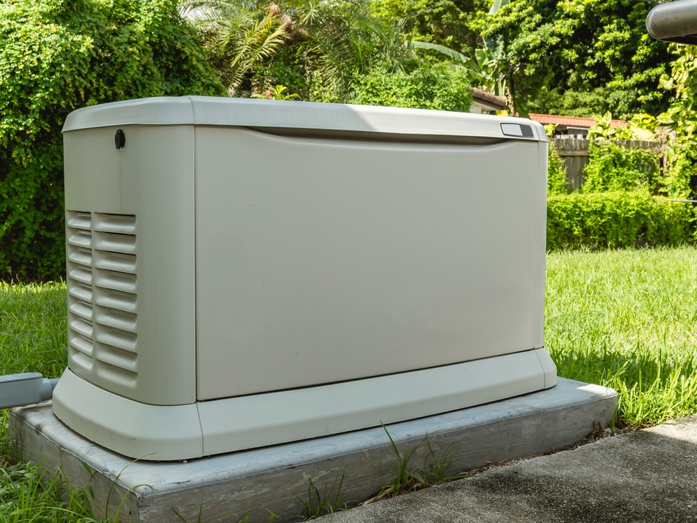 A whole home generator installed on a concrete slab