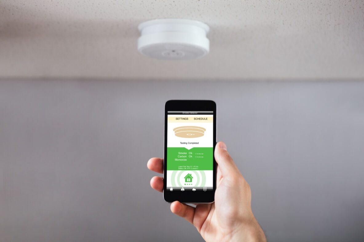 A phone app that is controlling a smart smoke detector in the background