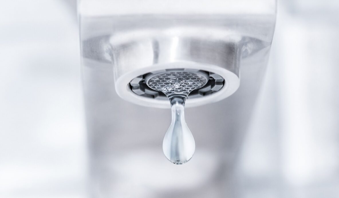 a dripping bathroom faucet, signaling a leak